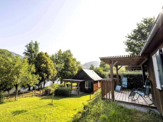 Chalet 32m² / 2 Schlafzimmer mit einer großen Terrasse mit Blick auf den Fluss Lot.