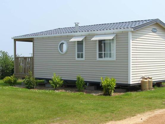 Mobilheim Panoramique 26m² Meersicht + überdachte Terrasse